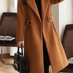 Brown overcoat with notched lapels, front buttons, and belt at the waist