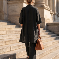 Black relaxed three-piece set seen from back with duster and wide-leg pants