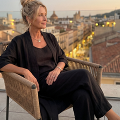 Black relaxed three-piece set with scoop-neck top and loose wide-leg pants