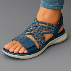 Blue open-toe woven sandals with crisscross straps and hook-and-loop heel strap