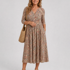 Beige floral midi dress with V-neck, three-quarter sleeves, and gathered skirt
