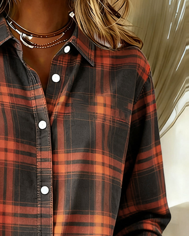 Plaid shirt chest close-up with notched collar and white buttons, orange and black