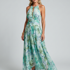 Green halter midi dress with soft floral print, pleated skirt and gathered waist