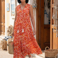 Orange sleeveless midi dress with V-neck, tassel-tie accents and tiered skirt