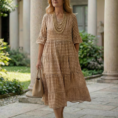 Brown polka dot tiered midi dress with short sleeves and gathered skirt