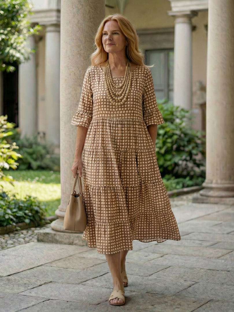 Brown polka dot tiered midi dress with short sleeves and gathered skirt