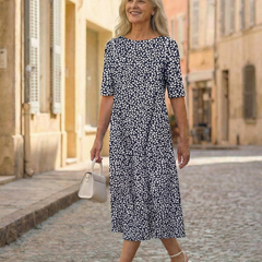 Blue patterned midi dress with short sleeves, round neckline and A-line fit