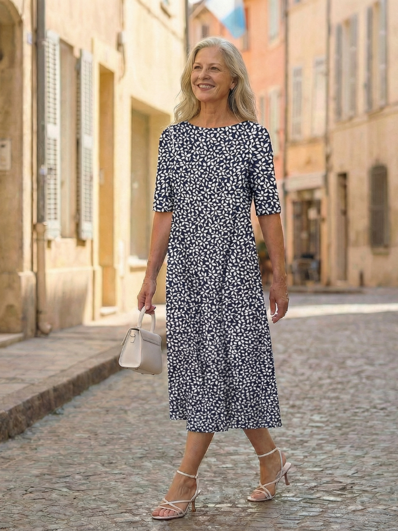 Blue patterned midi dress with short sleeves, round neckline and A-line fit