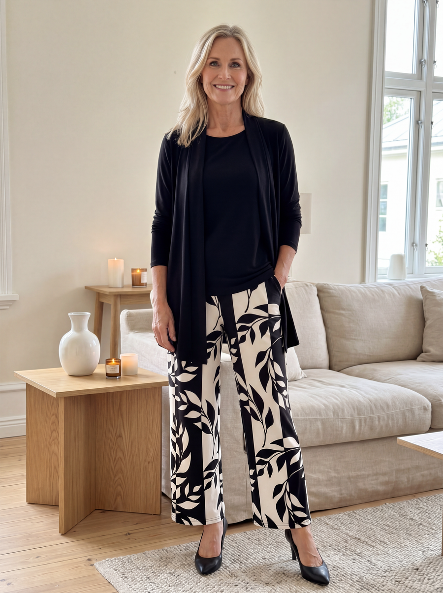 Black three-piece casual set: cardigan, scoop-neck top, leaf-print wide-leg pants