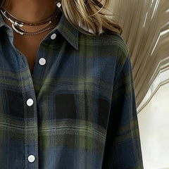 Plaid shirt collar close-up with white buttons in dark blue and green