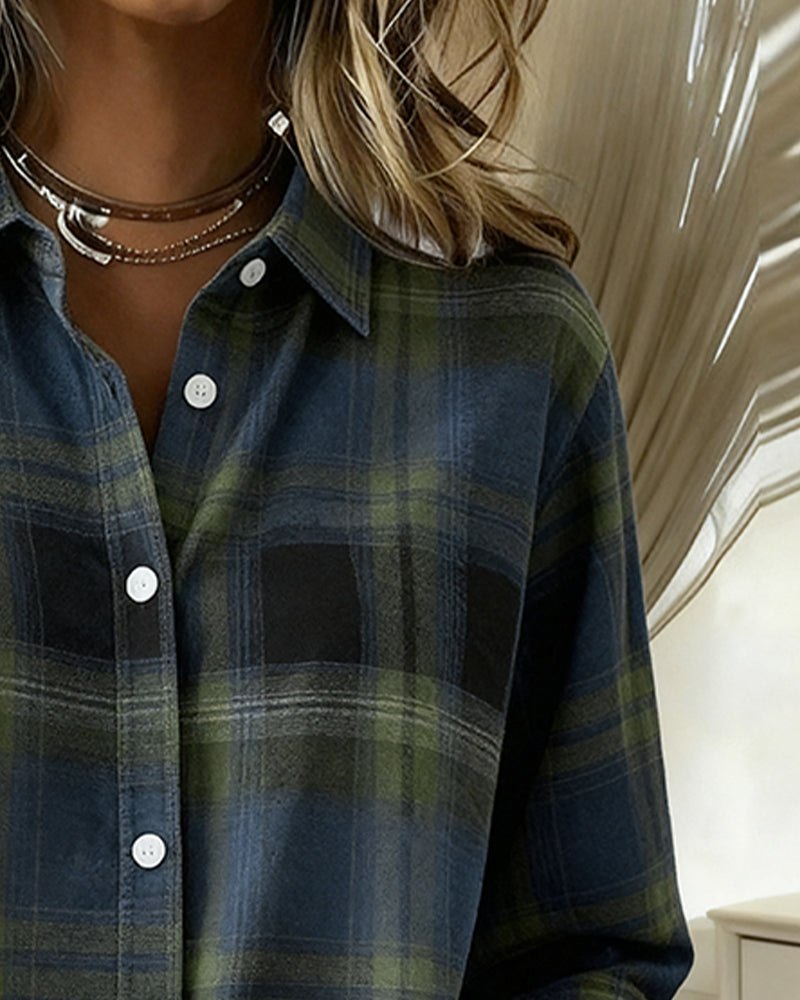 Plaid shirt collar close-up with white buttons in dark blue and green