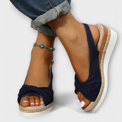 Navy espadrille sandals with bow-tied front and jute wedge sole