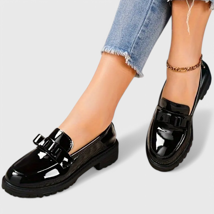 Black patent loafers with buckle strap and chunky block heel sole