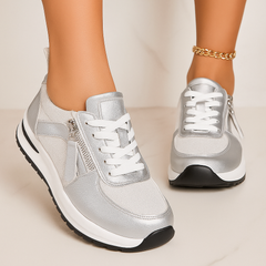 Silver zip-up comfort sneakers with white laces and side zipper, cushioned sole