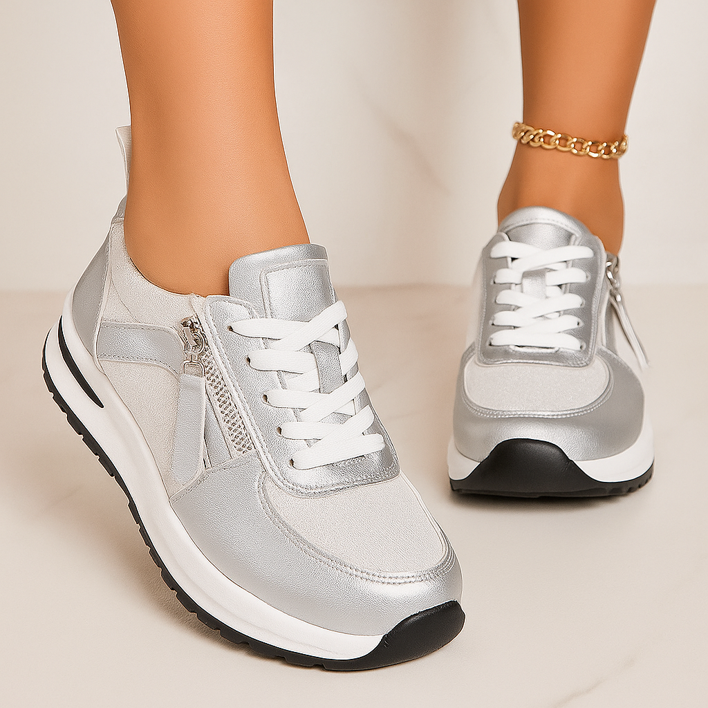 Silver zip-up comfort sneakers with white laces and side zipper, cushioned sole