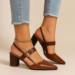 Brown heeled shoes with ring buckle, ankle strap, and gold ankle chain