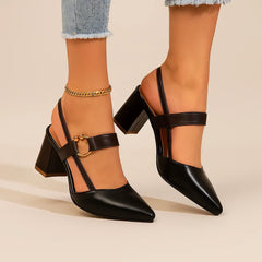 Pair of heeled slingback shoes in brown and black with ring buckles