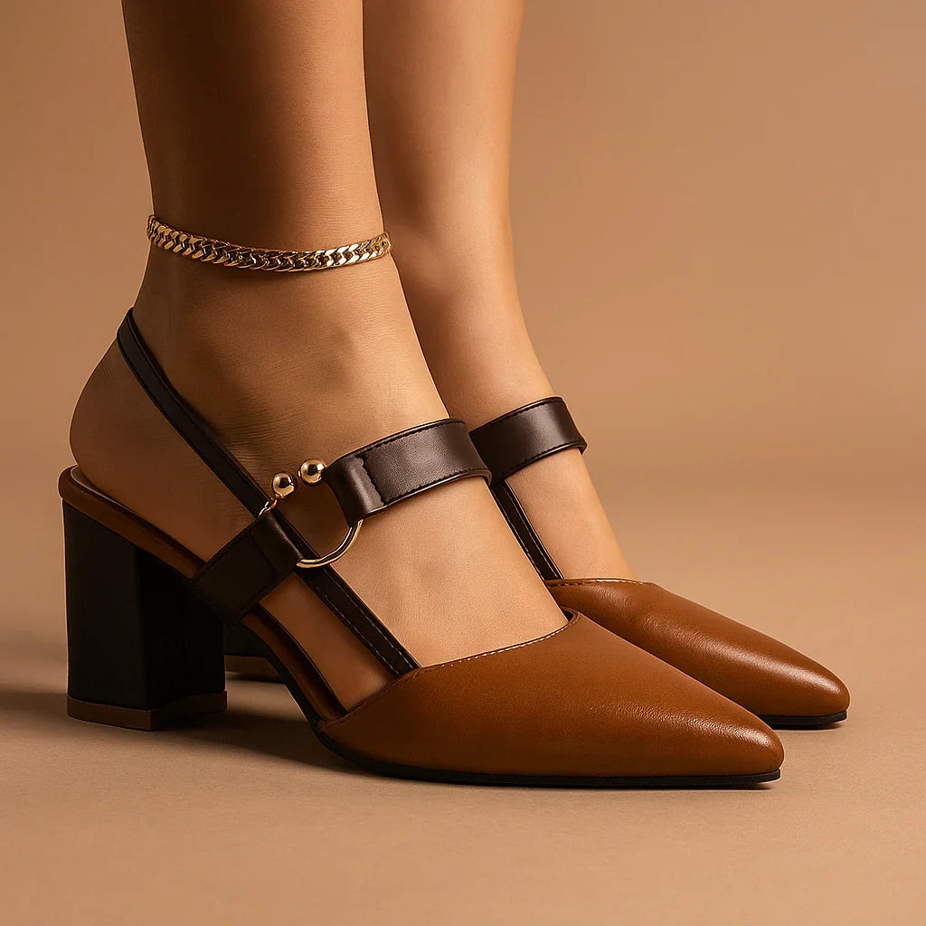 Brown heeled pumps with ring buckle, ankle strap, and gold chain