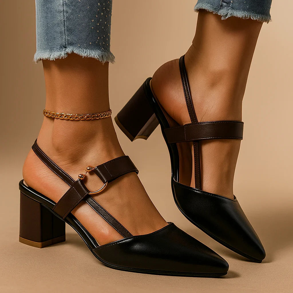 Black heeled slingbacks with ring buckle, black straps, and gold ankle chain