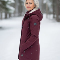 Burgundy sherpa-lined parka in side view with zip front, snap pockets, and drawcord hood