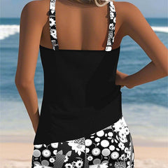 Belly-covering swim set, black racerback tank and black-and-white floral patterned swim shorts, back view