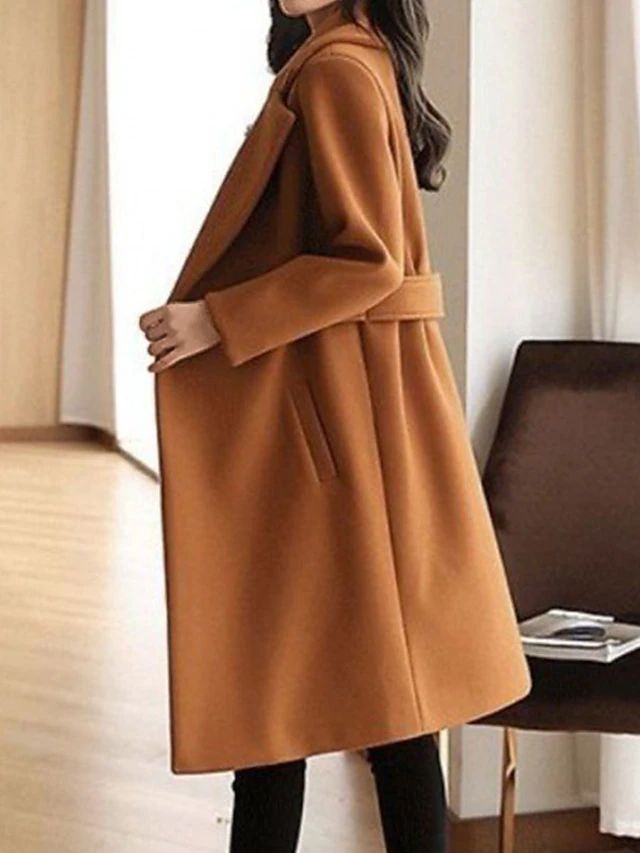 Cognac brown overcoat with notched lapels and belt at the waist