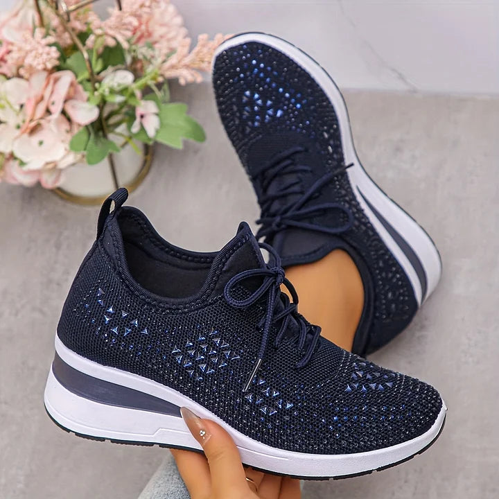 Navy blue knit comfort sneakers with lace-up closure, rhinestone geometric pattern, white sole