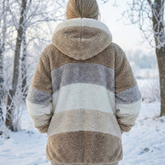 Colorblock plush hooded jacket with zip, tan and gray stripes, front pockets.