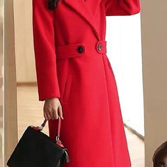 Red long overcoat with notched lapels, double-breasted buttons, and waist belt