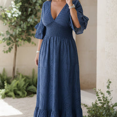 Waist-sculpting navy blue maxi dress with V-neck, flutter sleeves, and tiered eyelet hem