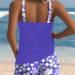 Back view of purple two-piece swimwear set: open-back tank with patterned swim shorts.