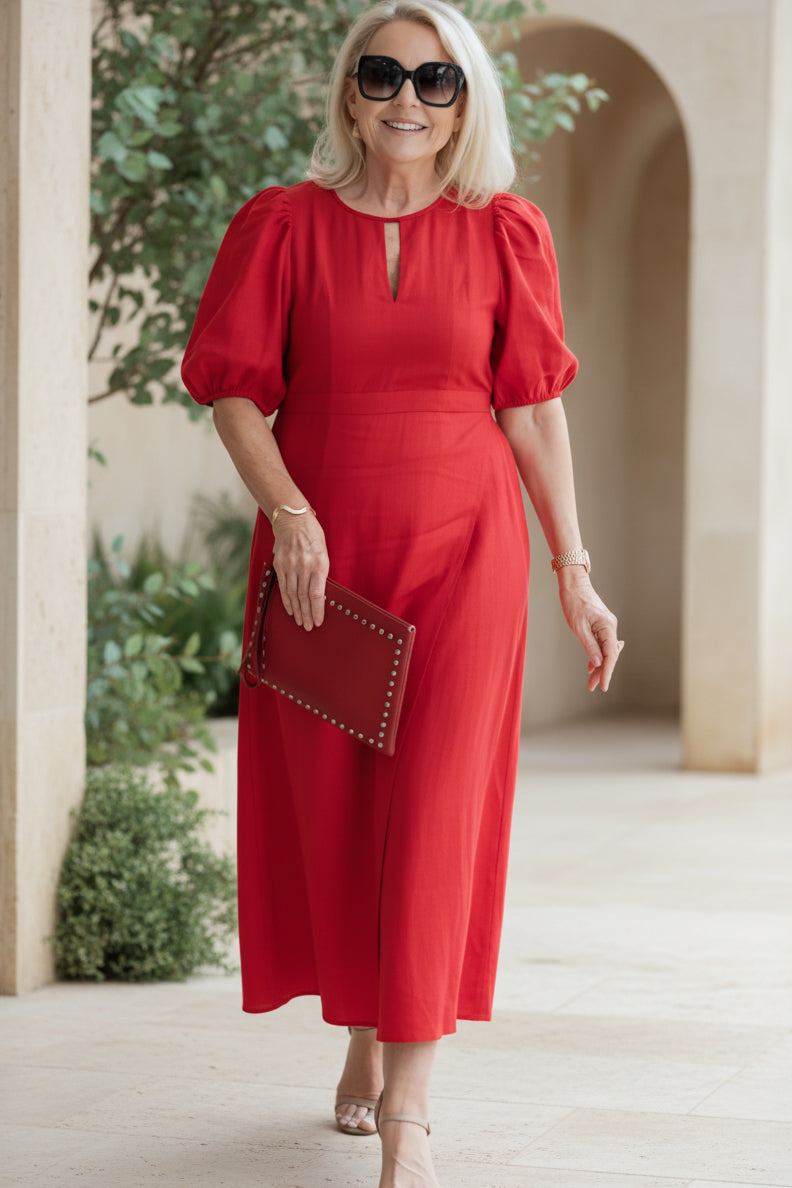 Rose red maxi dress with puff sleeves and keyhole neckline, gathered waist.