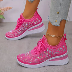 Hot pink knit lace-up sneakers with sparkly diamond cutout pattern and white sole