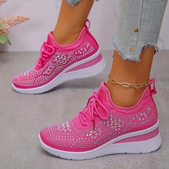 Hot pink knit lace-up sneakers with sparkly diamond cutout pattern and white sole