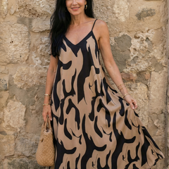 Beige desert flow dress with black abstract pattern, V-neck spaghetti straps, midi length