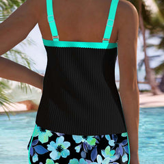 Back view of two-piece tankini set: black tank with teal straps, floral shorts