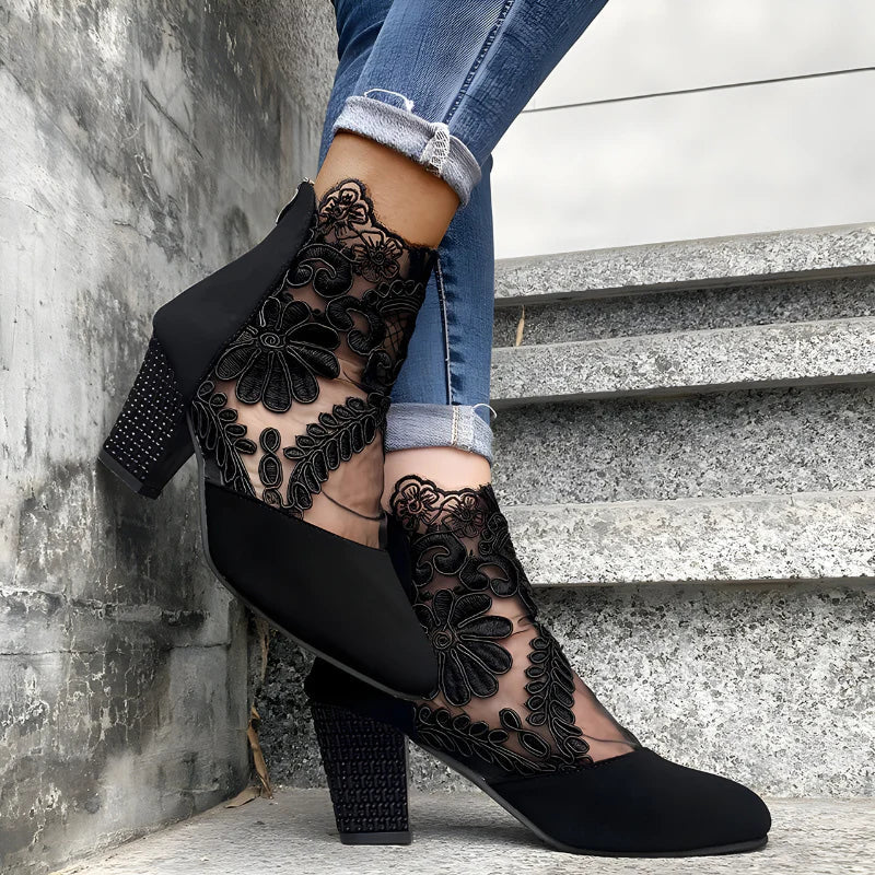 Black orthopedic heeled ankle boots with floral lace mesh and textured block heel