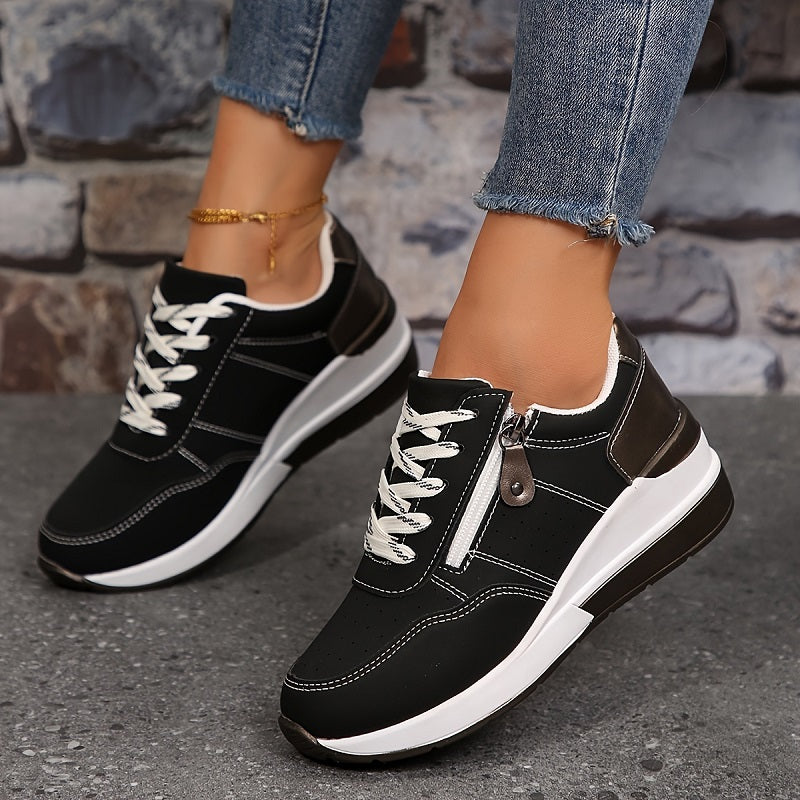 Black zip-up comfort sneakers with lace-up front, side zipper, white sole, low profile