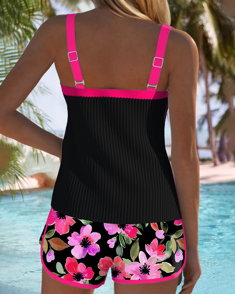 Back view of two-piece tankini set: black tank with purple straps, floral shorts