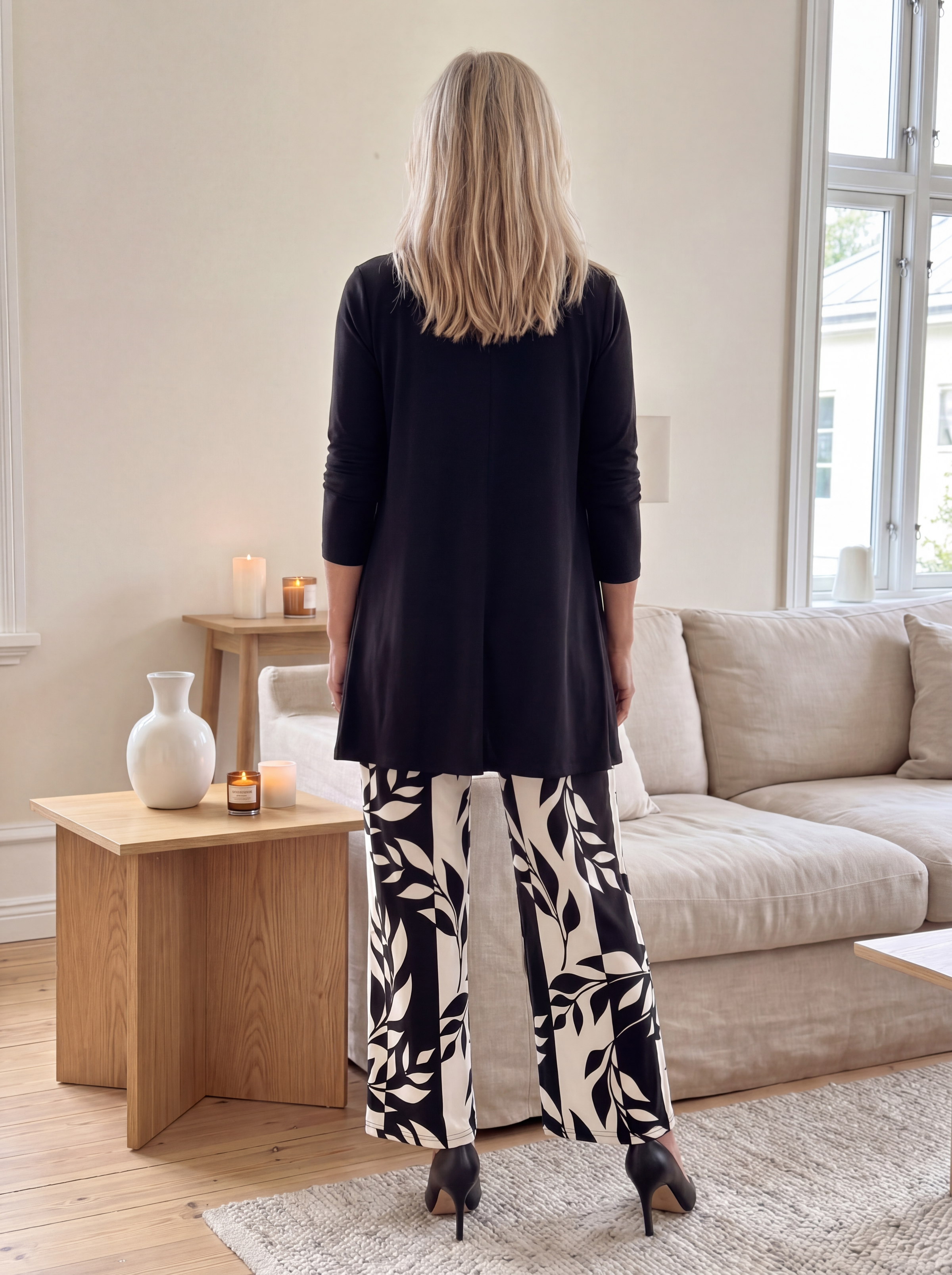 Black three-piece set, back view: long cardigan and leaf-print wide-leg pants