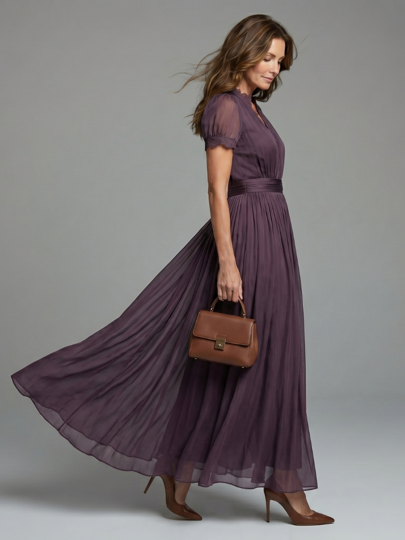 Purple maxi dress with gathered waist, puff sleeves, and flowing pleated skirt