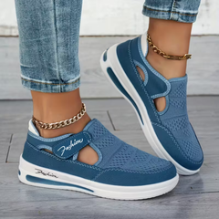 Blue comfort sneakers with side cutout, perforated upper, and white sole