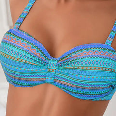 Close-up of teal striped bikini top with gathered center and underwire-style cups