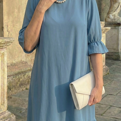Blue ruffle day dress with gathered neckline and tiered ruffle hem