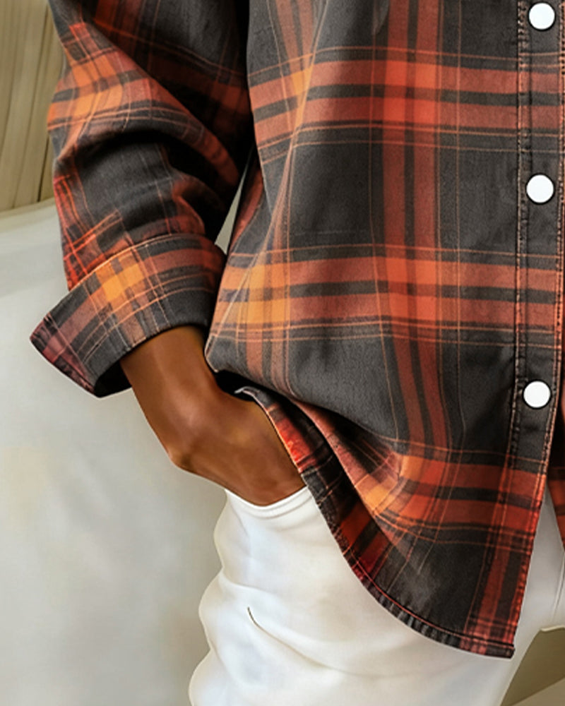 Plaid shirt sleeve and side hem detail in orange, rust, and dark charcoal