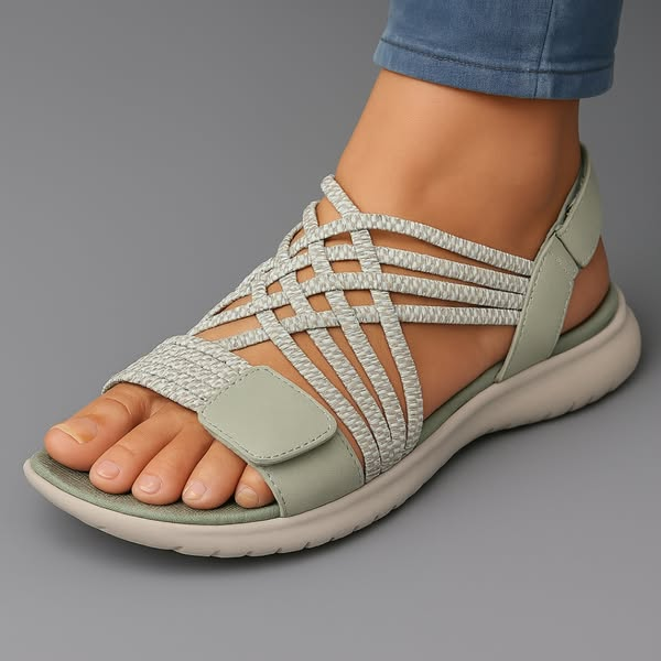 Light gray woven strappy sandals with crisscross upper and cushioned sole