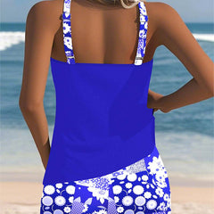 Belly-covering swim set, royal blue racerback tank and blue floral patterned swim shorts, back view
