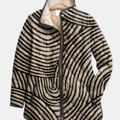 Black and cream zebra-striped quilted jacket with button front and stand collar