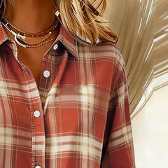 Plaid button-up shirt with notched collar, orange-red and white check, button front