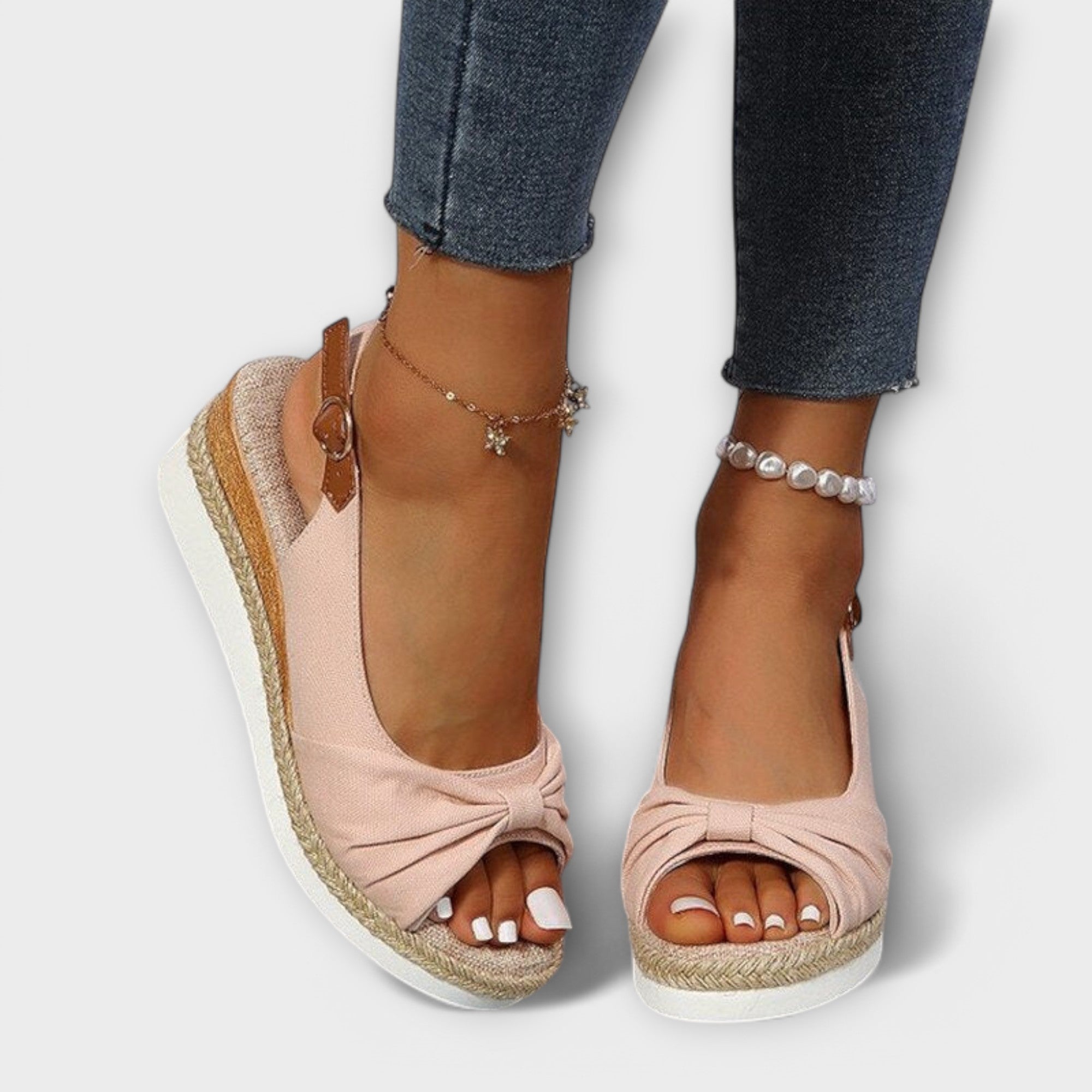 Blush pink espadrille sandals with knotted front and jute wedge sole